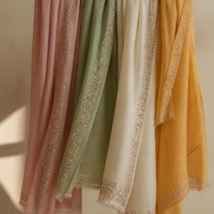 Pashmina stoles hanging on a wooden rail